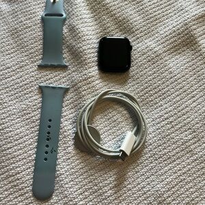 Apple Watch w/ band and original charging cable.